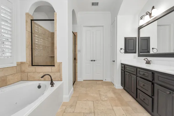 a bathroom with a double vanity sink mirror and