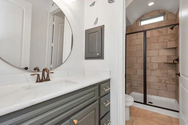 an empty room with fan and entrance