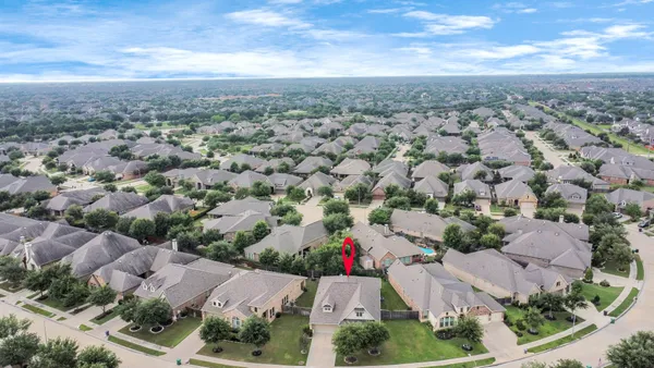 an aerial view of house with yard