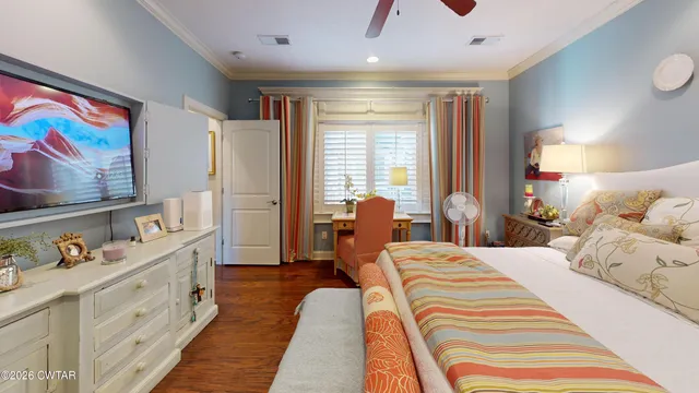 a bedroom with double bed and a window