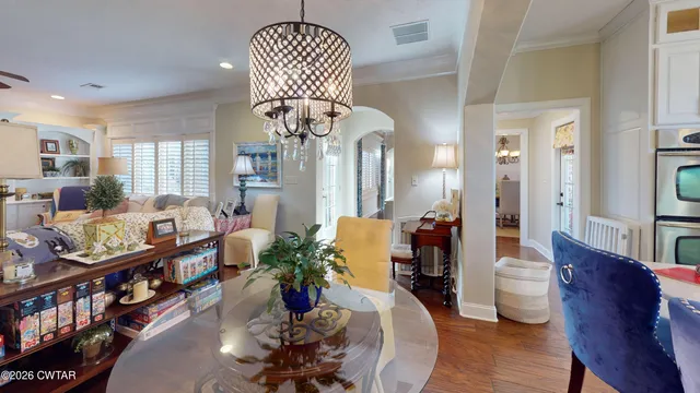 a view of entryway dining room and hall with wooden floor
