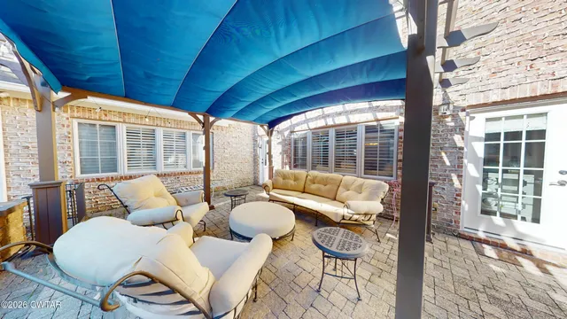 a outdoor living space with furniture and garden view