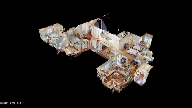 a bed sitting in a bedroom next to a lamp