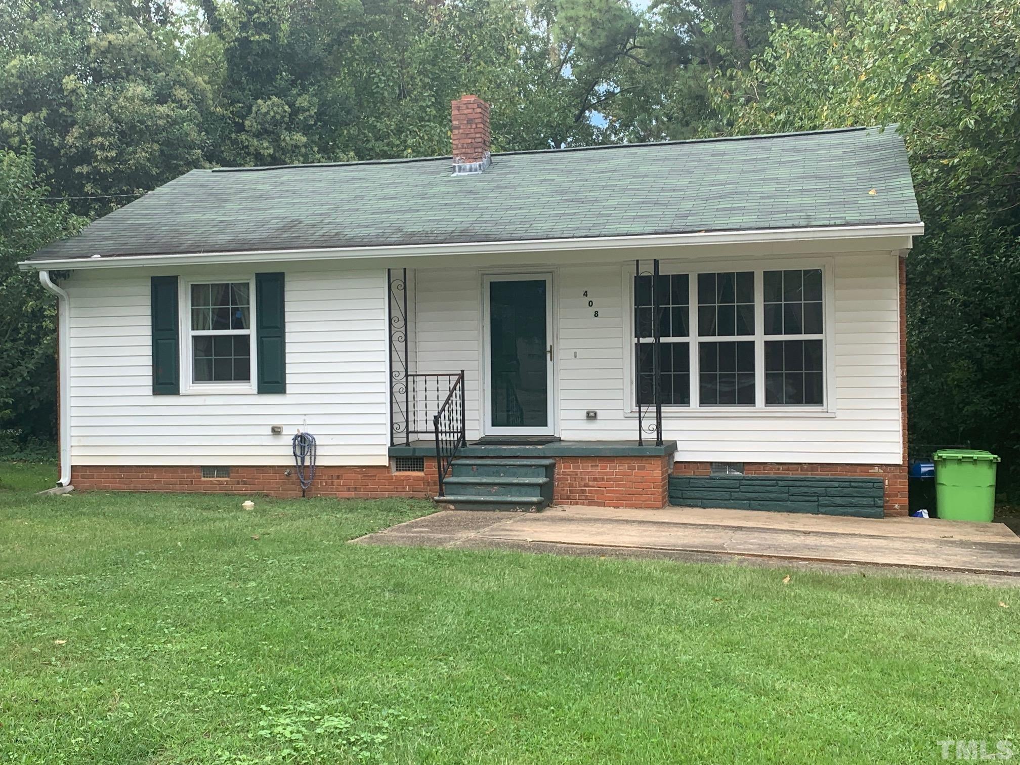 408 Lansing Street Raleigh, NC 27610 - Photo 1 of 11 a front view of a house with a yard
