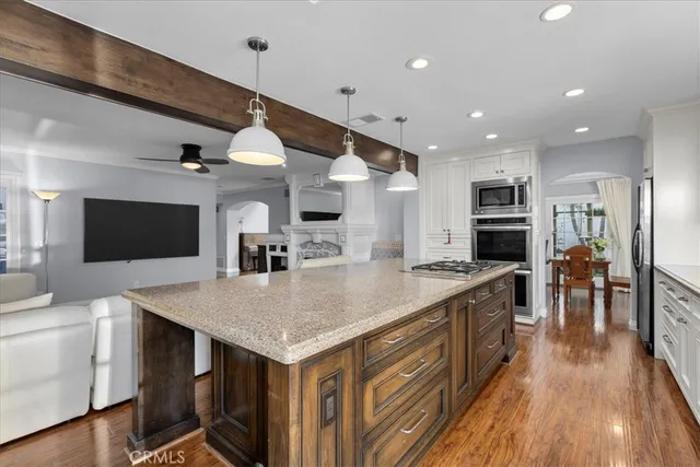 a large kitchen with a table and chairs
