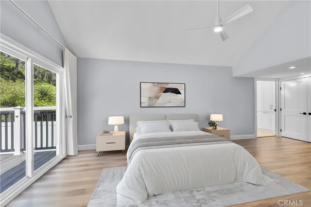 a bedroom with a large bed and a large window