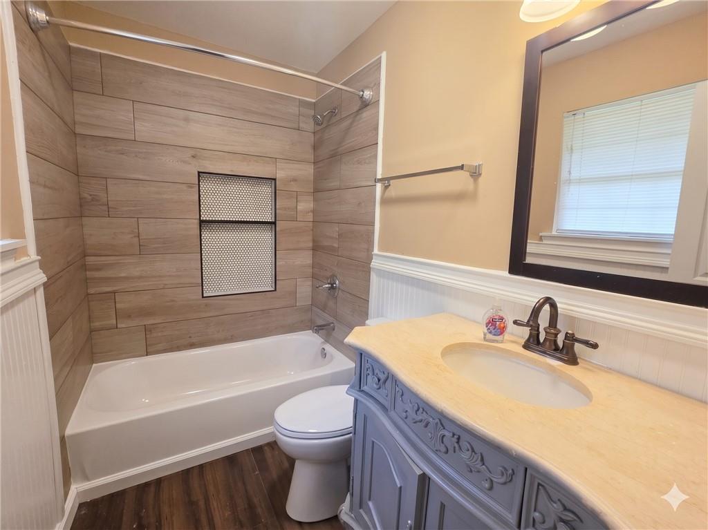 1929 Wee Kirk Road Southeast Atlanta, GA 30316 - Photo 17 of 22 a bathroom with a granite countertop sink toilet and bathtub