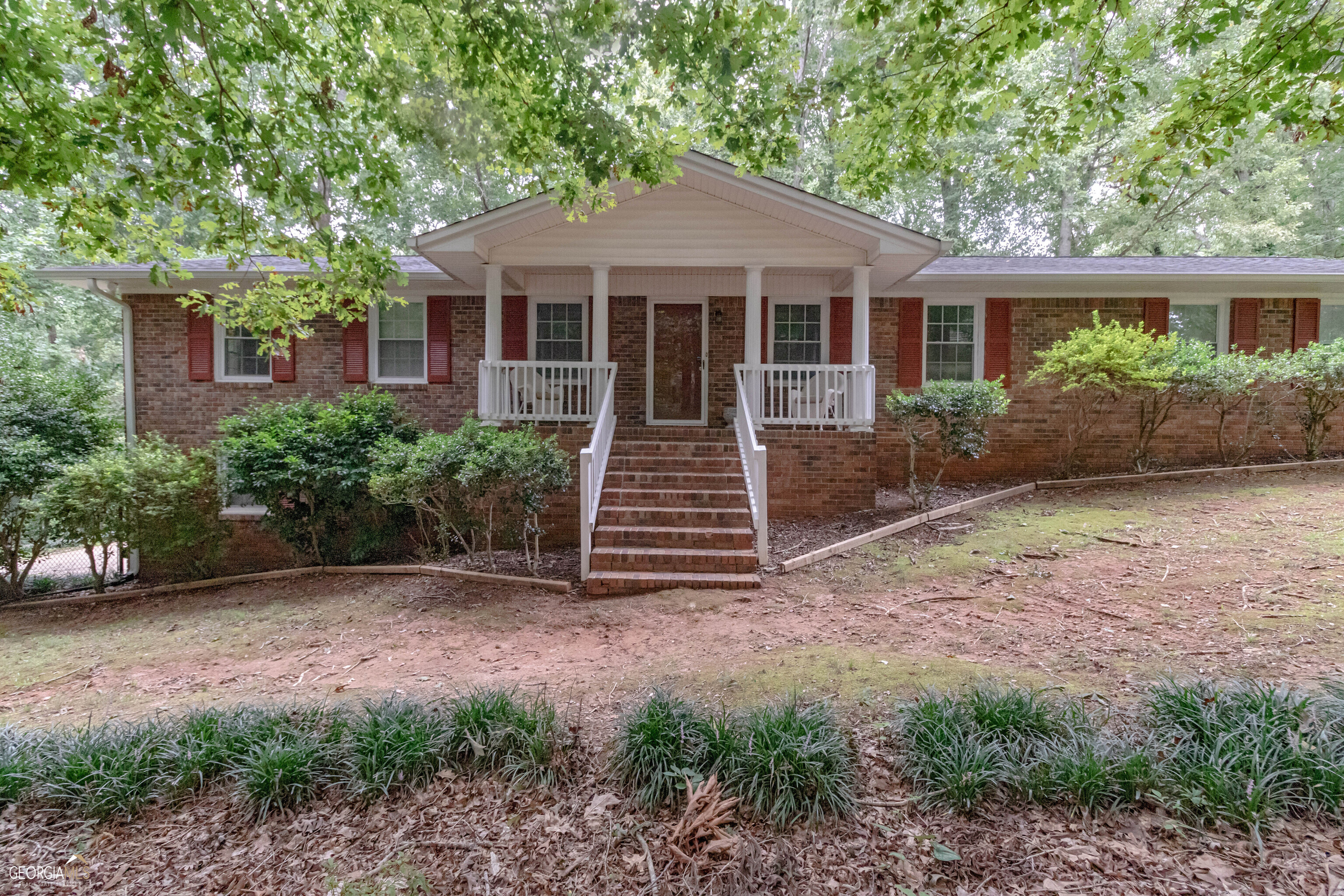 355 Thurman Road Stockbridge, GA 30281 - Photo 1 of 1 a front view of a house with a garden