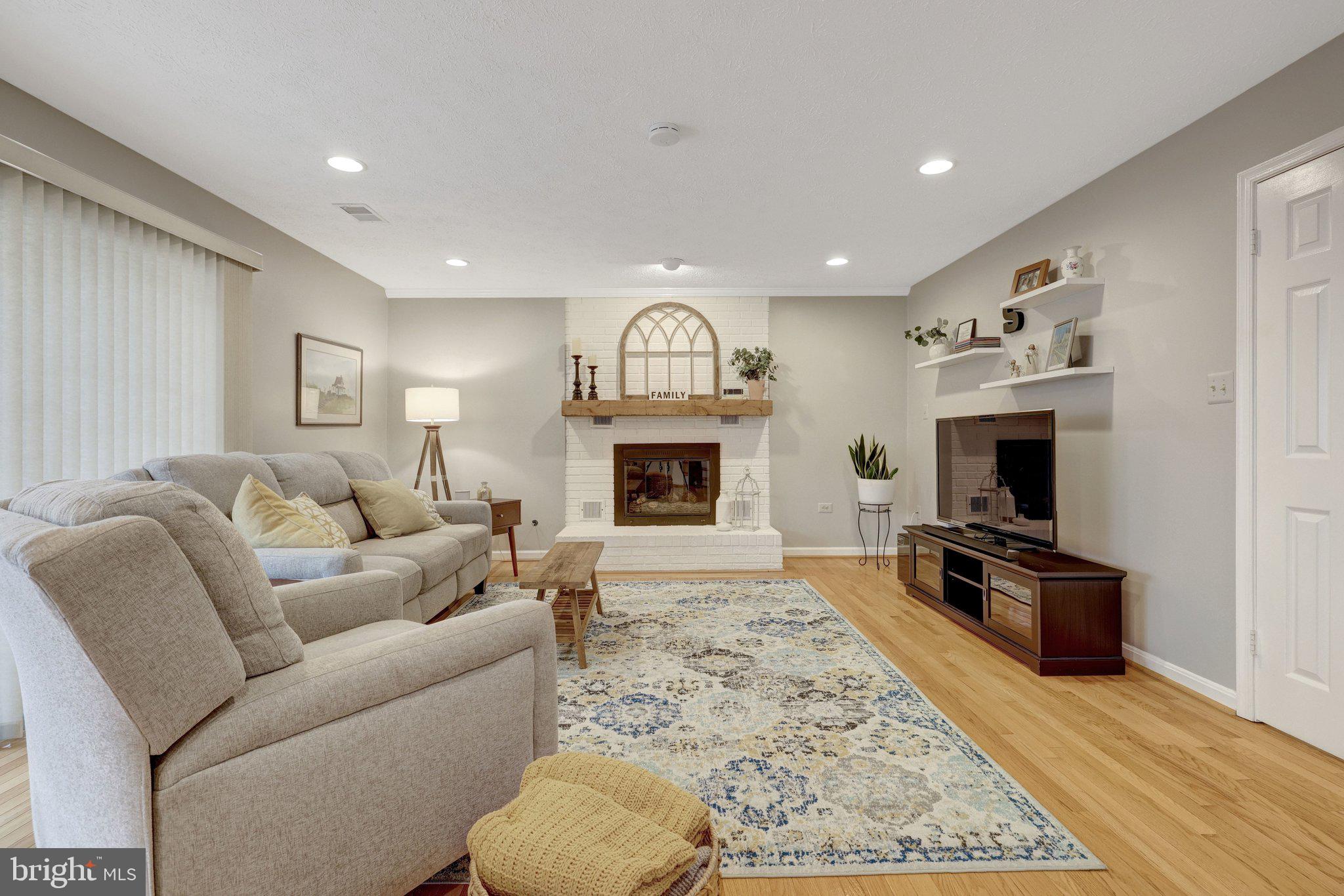 34 Lipscomb Court Sterling, VA 20165 - Photo 26 of 91 a living room with furniture fireplace and flat screen tv