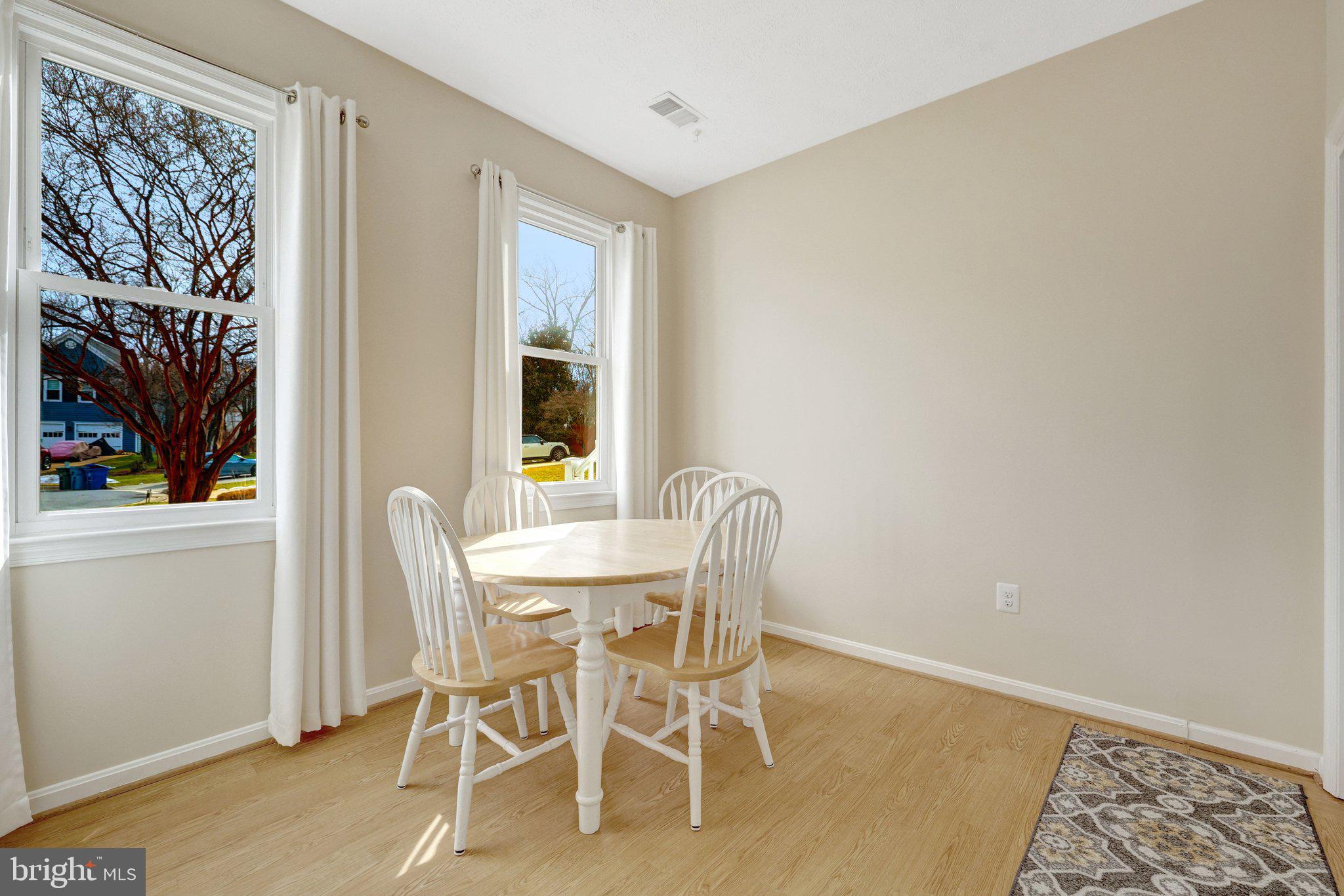 34 Lipscomb Court Sterling, VA 20165 - Photo 34 of 91 a view of a dining room with furniture and window