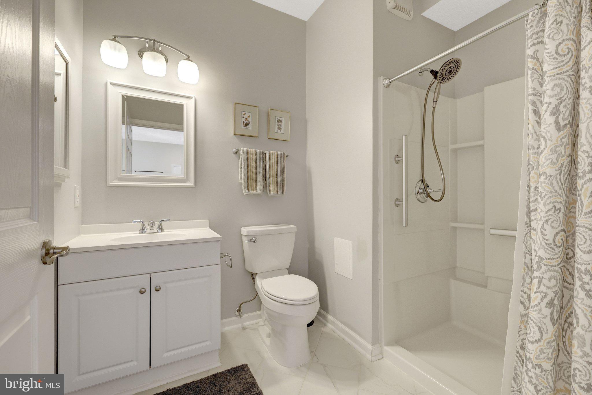 34 Lipscomb Court Sterling, VA 20165 - Photo 36 of 91 a bathroom with a granite countertop sink a toilet and shower