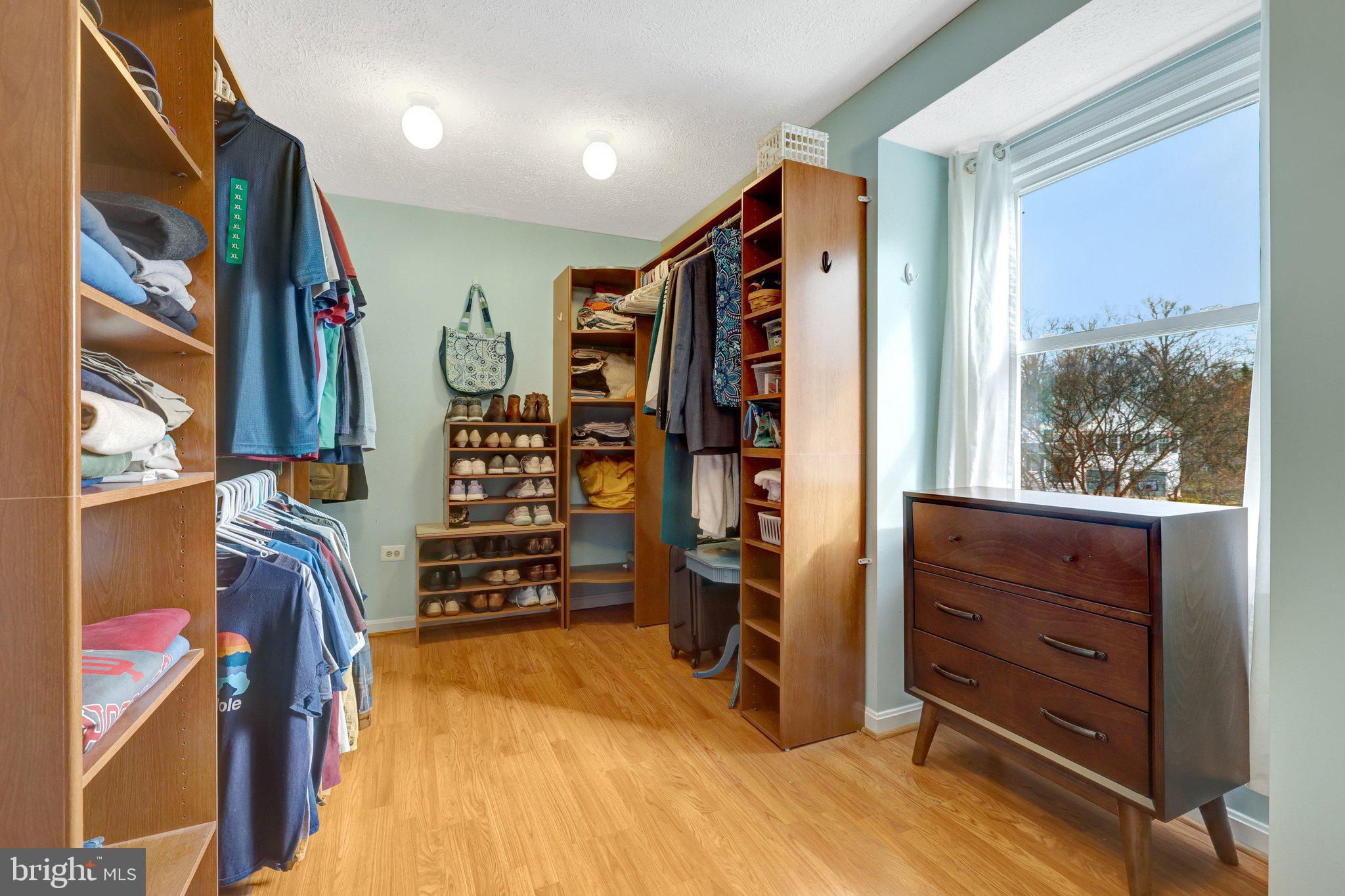 34 Lipscomb Court Sterling, VA 20165 - Photo 47 of 91 a view of walk in closet with clothes and shoes