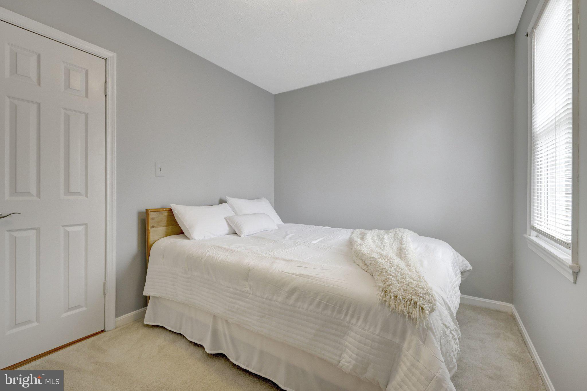 34 Lipscomb Court Sterling, VA 20165 - Photo 49 of 91 a bedroom with a bed and window