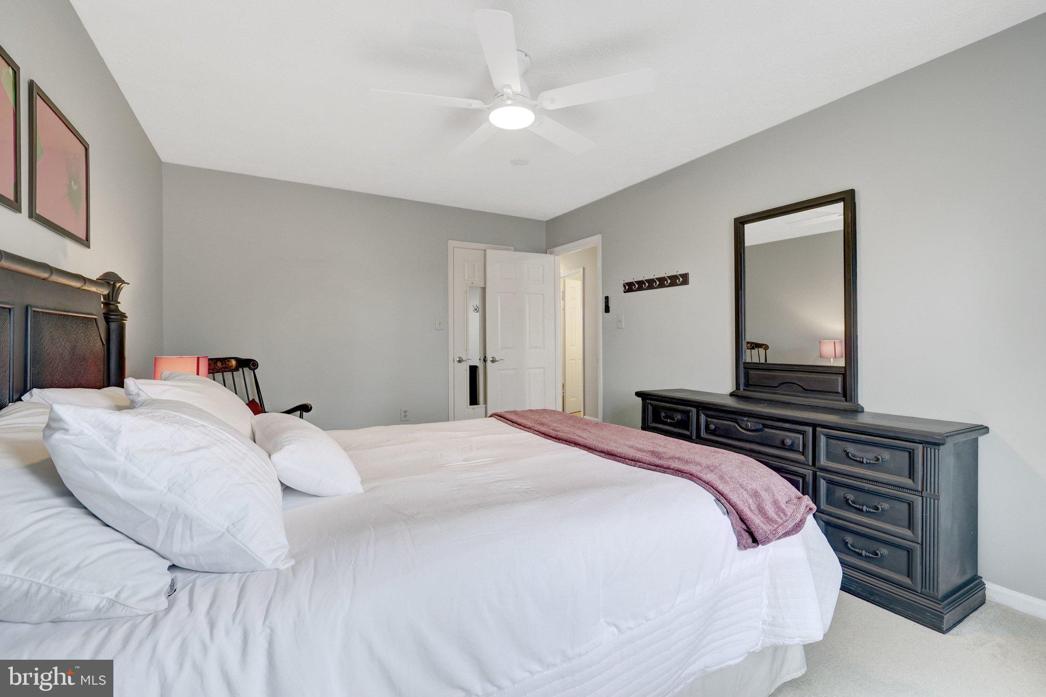 34 Lipscomb Court Sterling, VA 20165 - Photo 50 of 91 a bedroom with a bed and a dresser