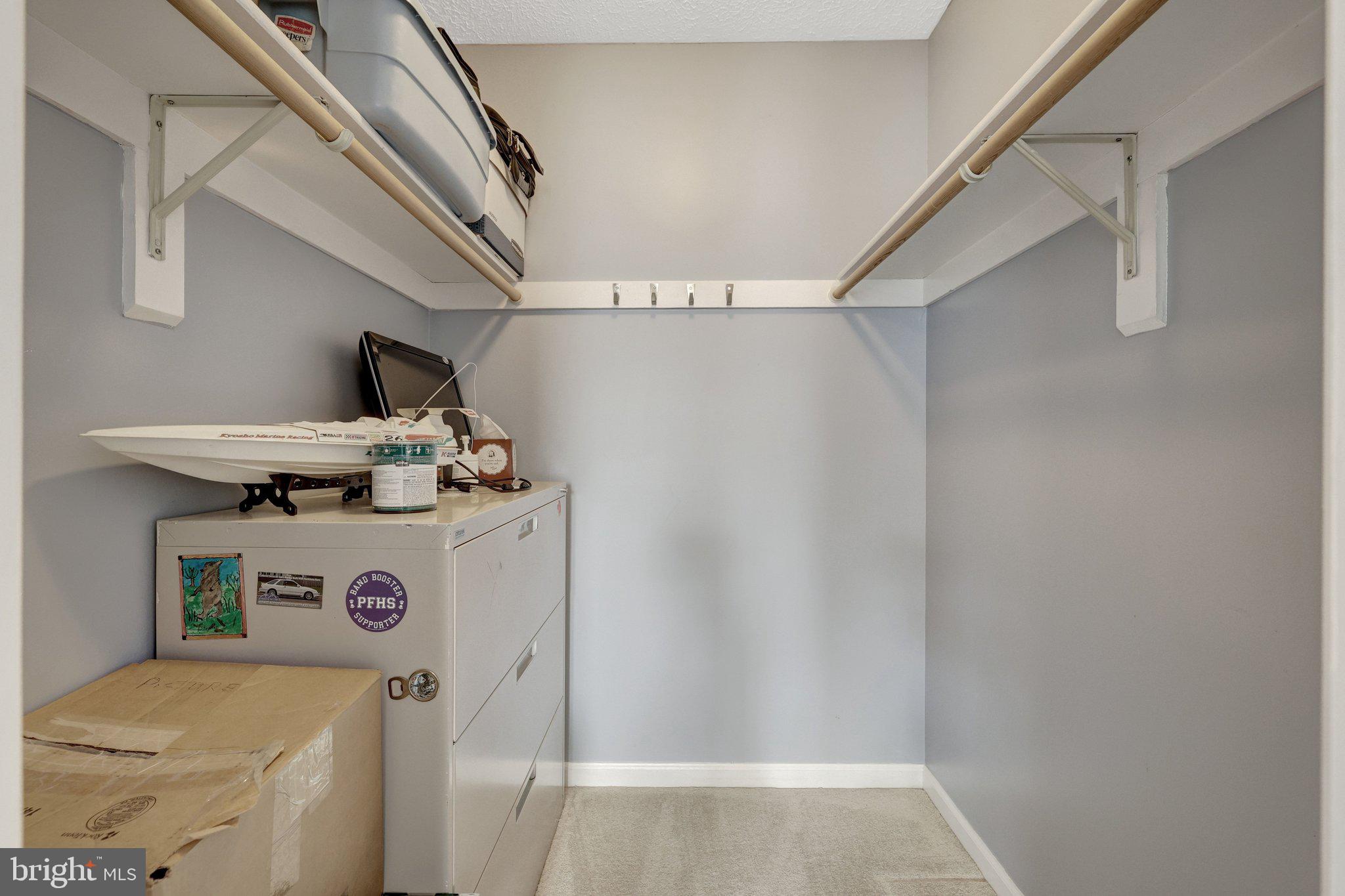 34 Lipscomb Court Sterling, VA 20165 - Photo 57 of 91 a view of storage and utility room with racks on the wall