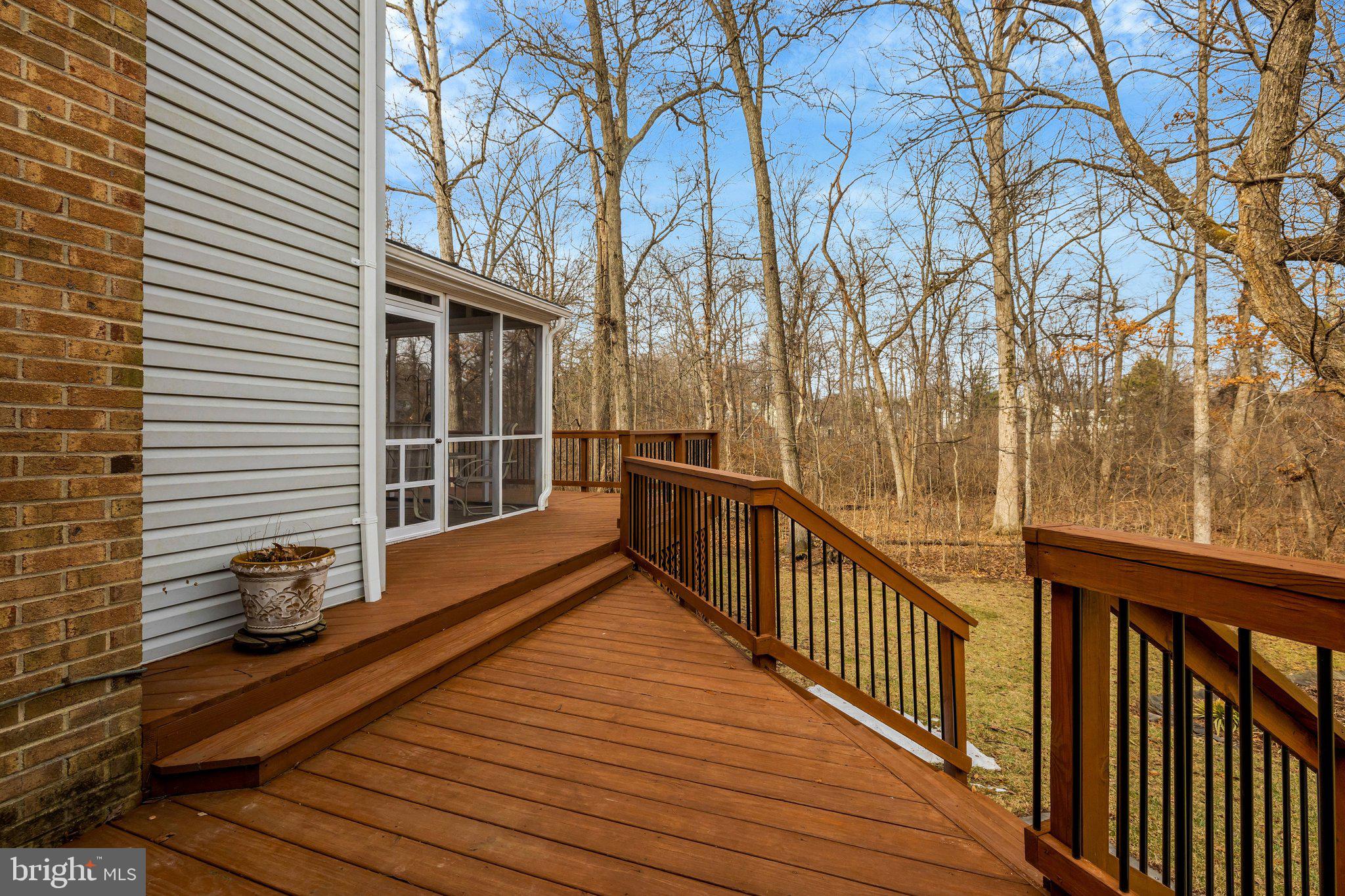 34 Lipscomb Court Sterling, VA 20165 - Photo 63 of 91 a view of a balcony with wooden floor and fence