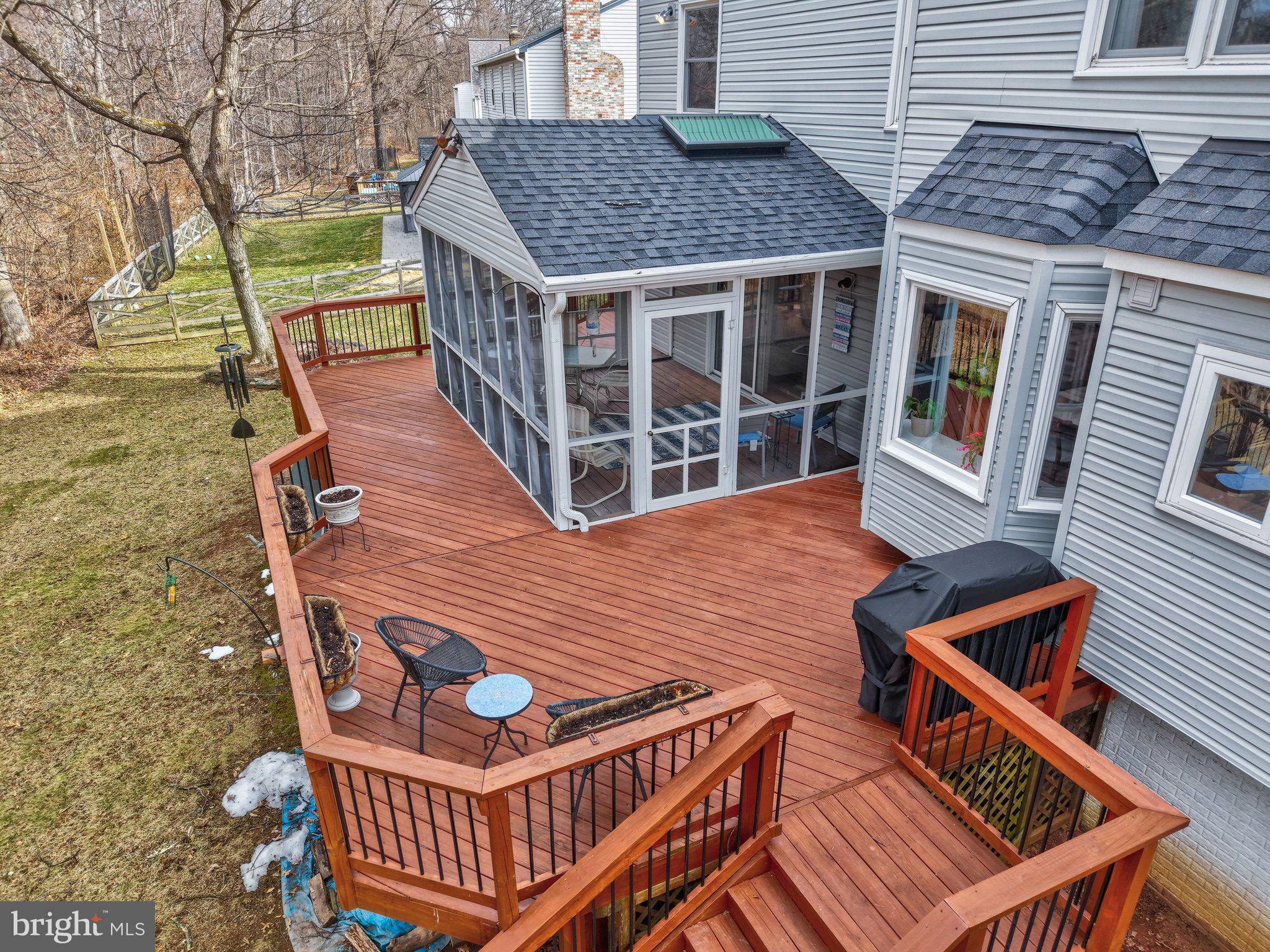 34 Lipscomb Court Sterling, VA 20165 - Photo 66 of 91 a view of a roof deck with wooden floor and fence