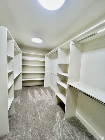 812 East Bates Cyn Road Tooele, UT 84074 - Photo 37 of 144 Walk-in closet featuring extensive built-in shelving, hanging rods, and recessed lighting