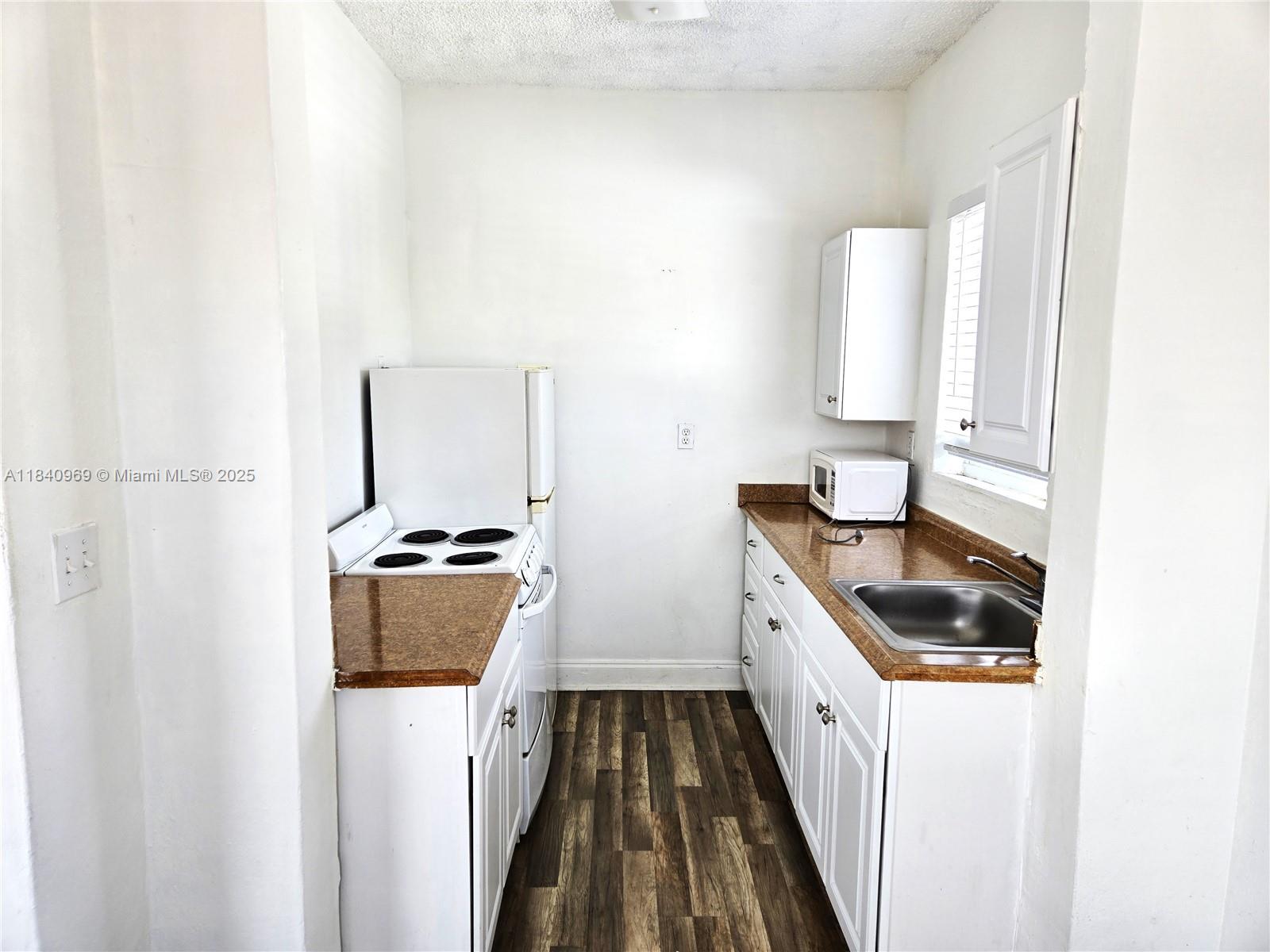 384 Tamiami Canal Road, Unit 4 Miami, FL 33144 - Photo 5 of 11