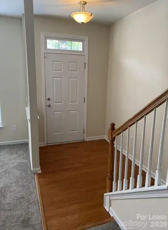 a view of entryway with wooden floor
