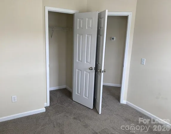 a bathroom with a sink vanity mirror and toilet