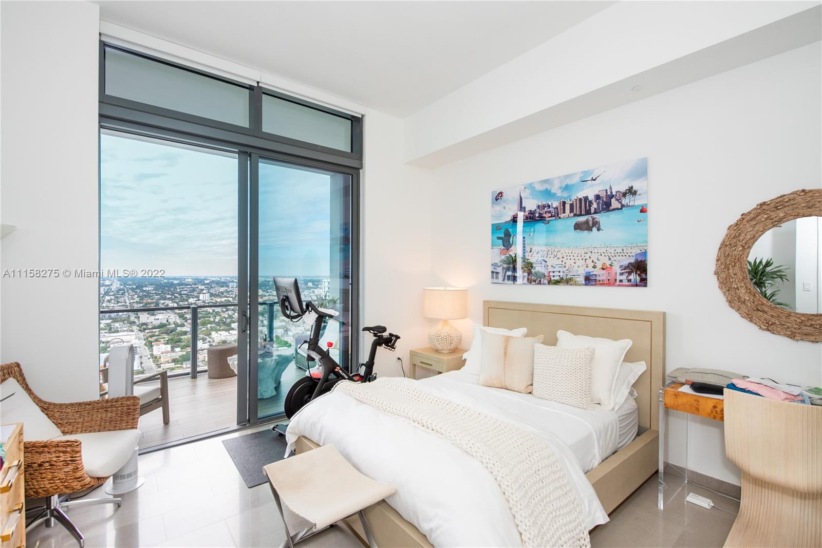 88 Southwest 7th Street, Unit 4110 Miami, FL 33130 - Photo 14 of 33 a bedroom with a bed and a table