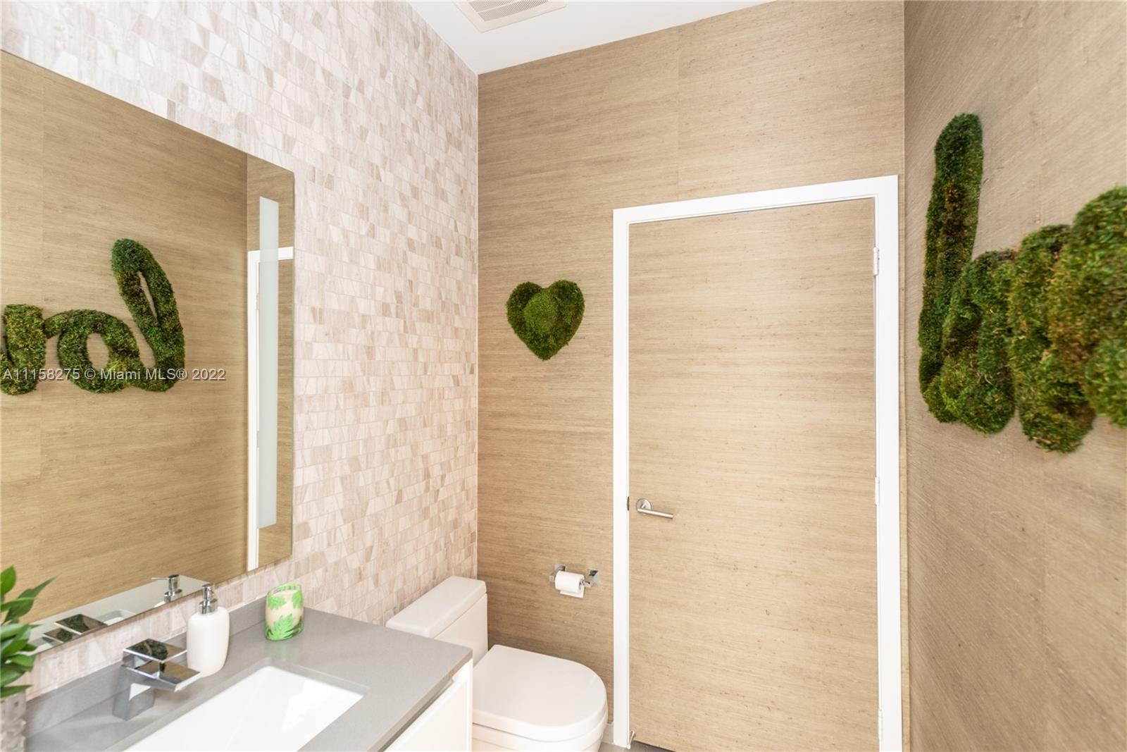 88 Southwest 7th Street, Unit 4110 Miami, FL 33130 - Photo 17 of 33 a bathroom with a sink a toilet and shower