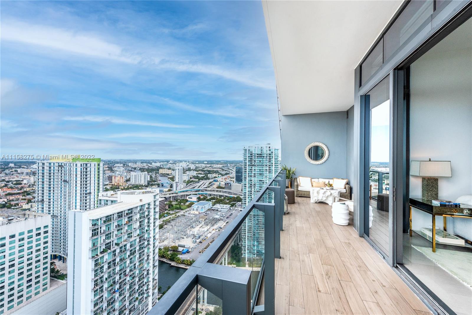 88 Southwest 7th Street, Unit 4110 Miami, FL 33130 - Photo 2 of 33 a view of a balcony with wooden floor