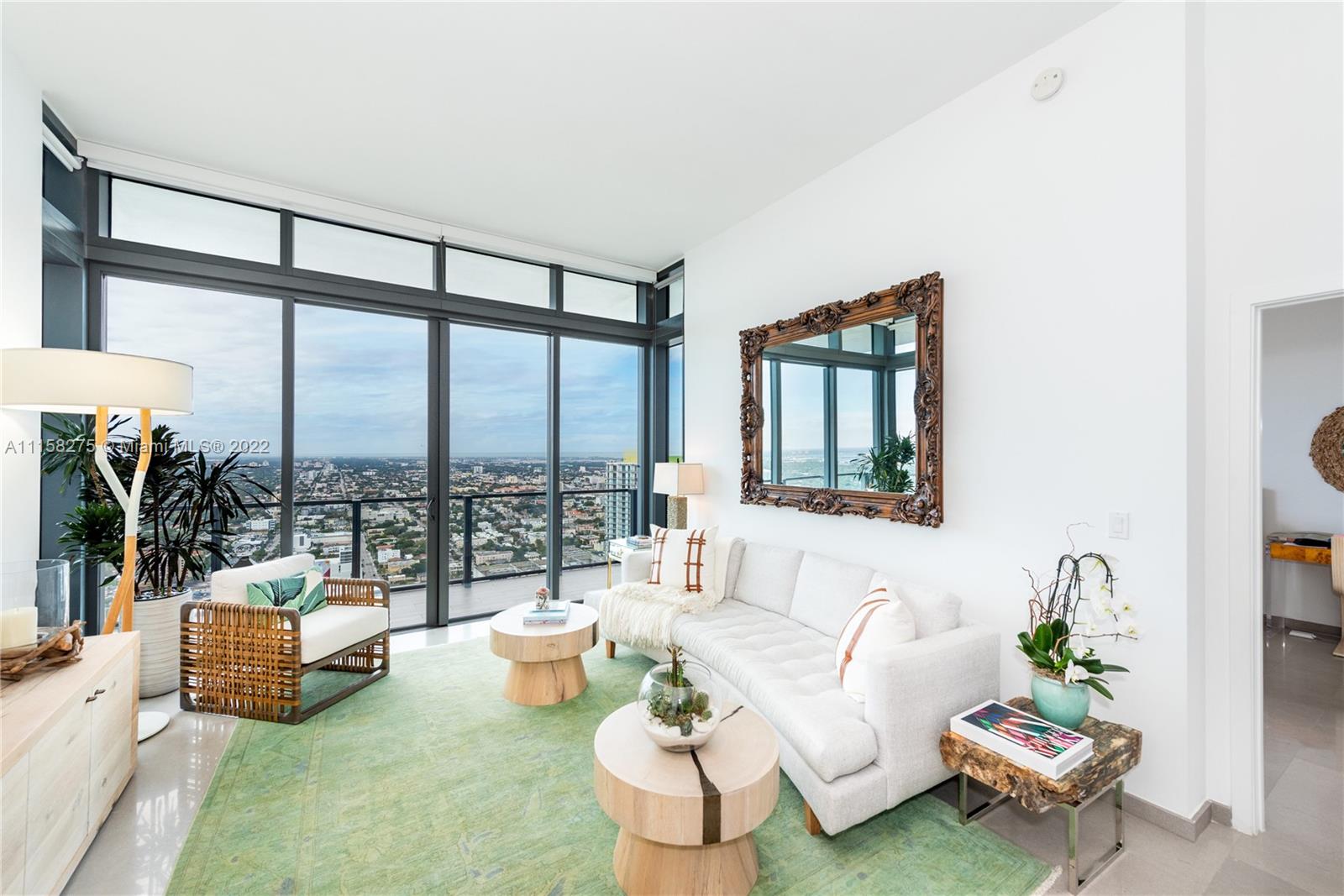 88 Southwest 7th Street, Unit 4110 Miami, FL 33130 - Photo 3 of 33 a living room with furniture and a large window