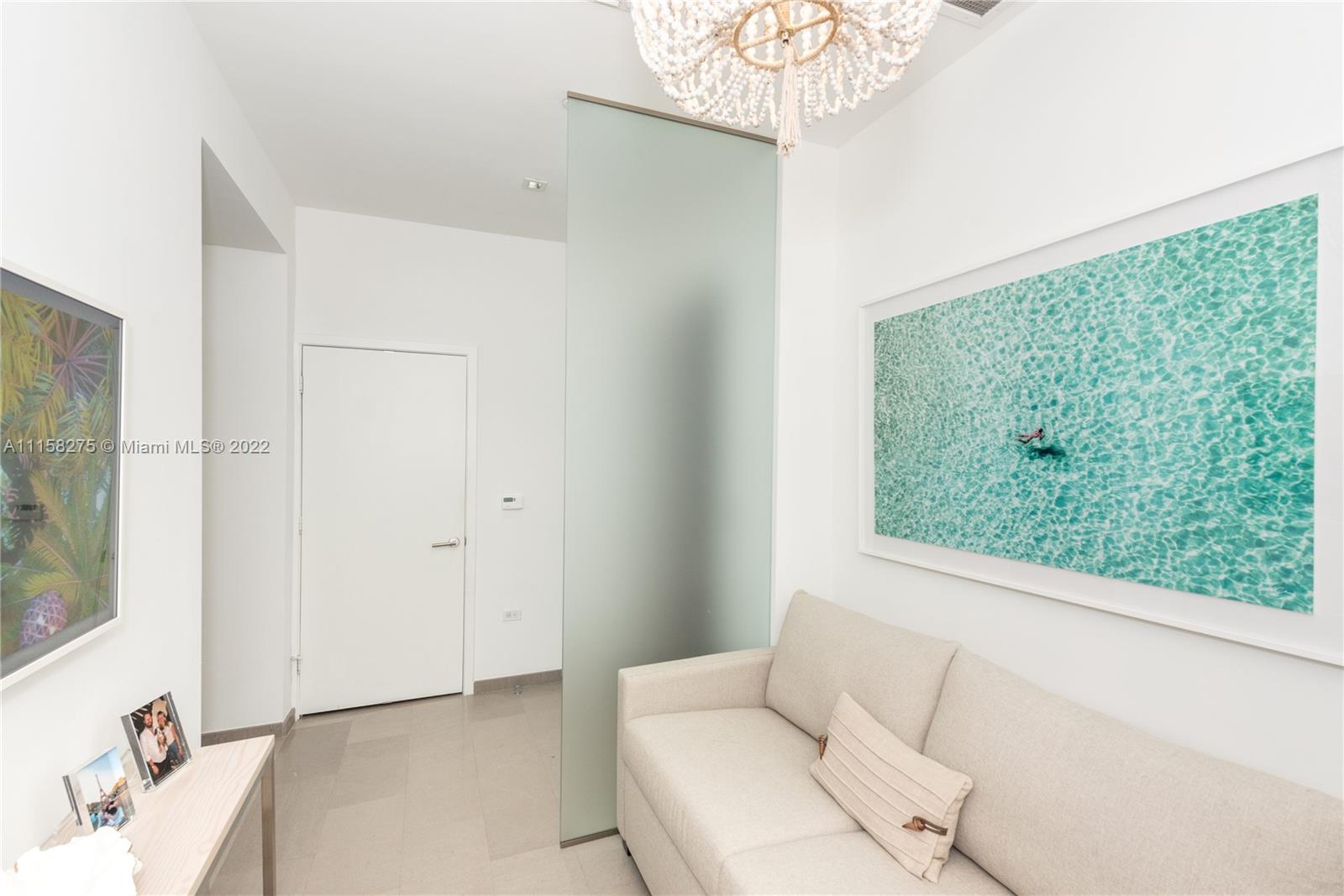 88 Southwest 7th Street, Unit 4110 Miami, FL 33130 - Photo 8 of 33 a living room with furniture and a window