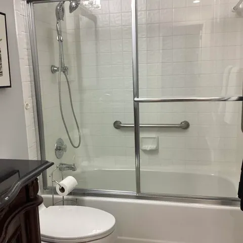 a bathroom with a toilet and shower