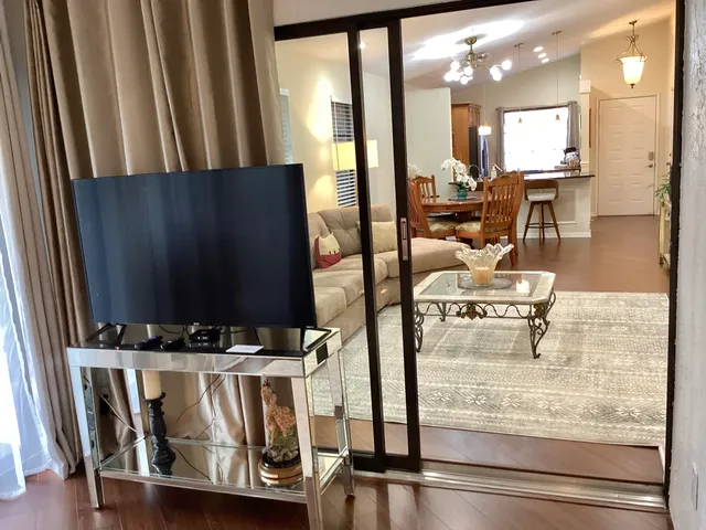 a view of living room with furniture and a flat screen tv