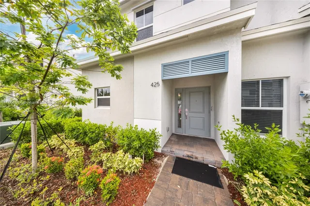 a view of a entryway door front of house