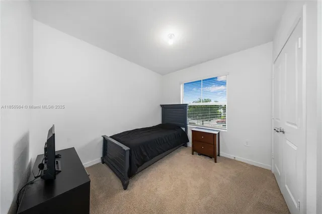 a living room with furniture and a gate