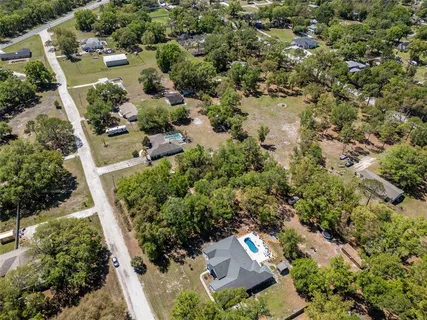 an aerial view of residential house with outdoor space