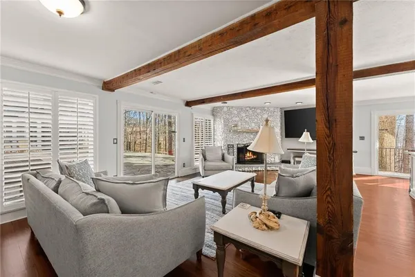 a kitchen with stainless steel appliances granite countertop a stove oven and a wooden floors