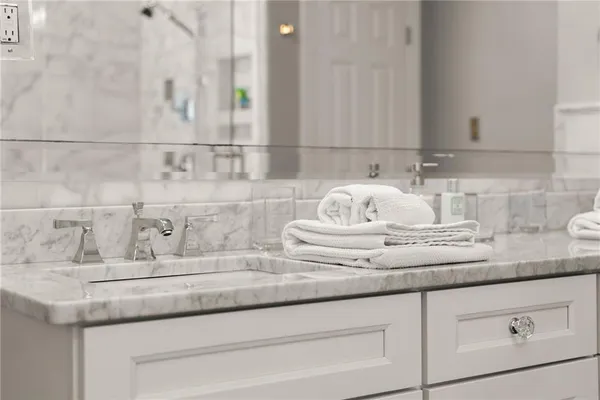 a kitchen with stainless steel appliances a refrigerator stove and microwave