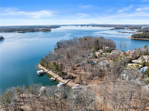 a large white kitchen with a large window