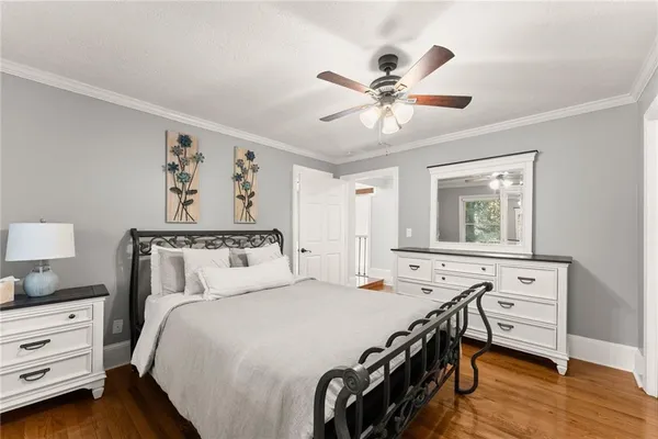 a bed room with a bed and a television