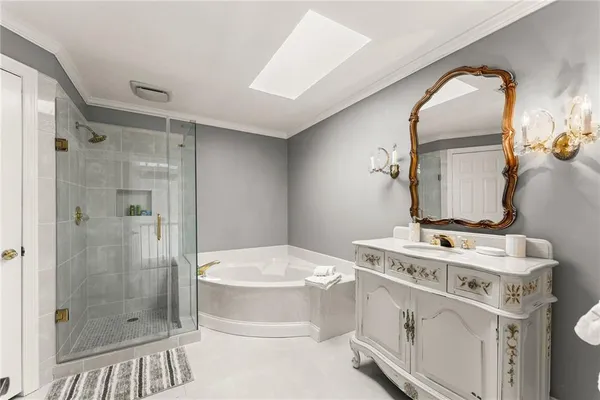 a front view of a house with a garden and yard