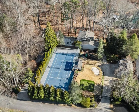 a large kitchen with stainless steel appliances granite countertop a large counter top a sink and a refrigerator