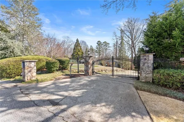 a dining room with stainless steel appliances kitchen island granite countertop a dining table and chairs