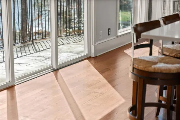 a bedroom with furniture and a wooden floor