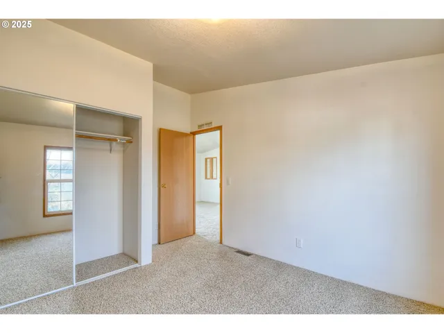 a view of a hallway with washer and dryer