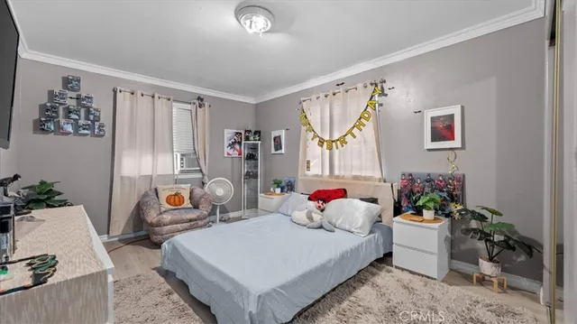 a bedroom with furniture and a bed