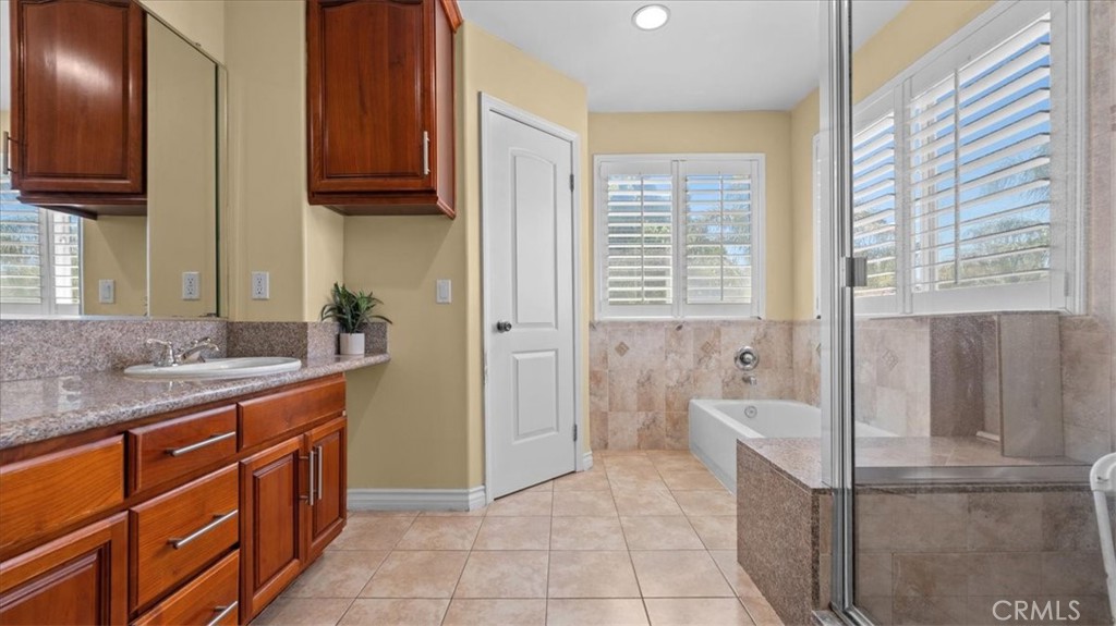 10115 Onyx Way Riverside, CA 92503 - Photo 9 of 18 a kitchen with stainless steel appliances granite countertop a refrigerator and a sink