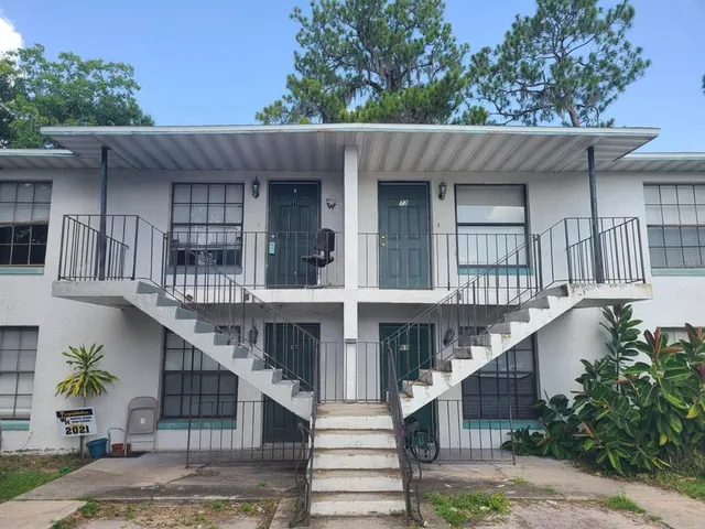 a view of an empty room and wooden floor