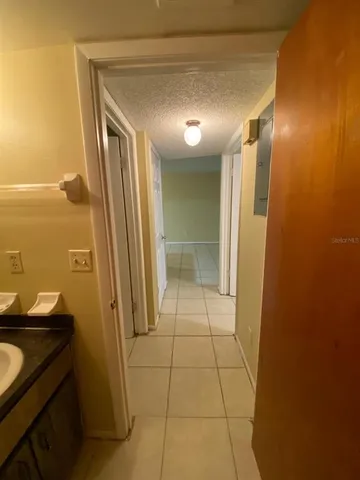 a view of an empty room and a window