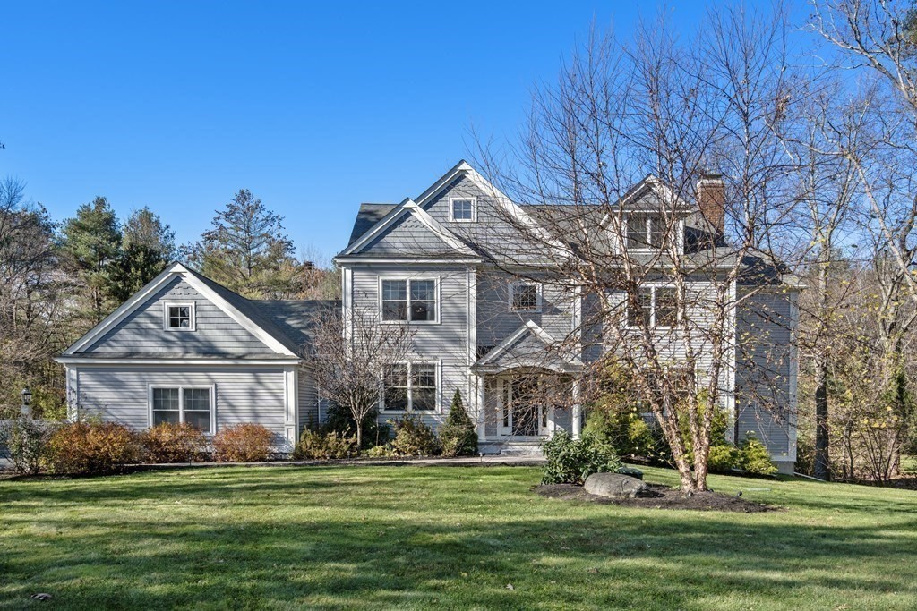 33 Centre Street Dover, MA 02030 - Photo 1 of 32 a front view of a house with a garden