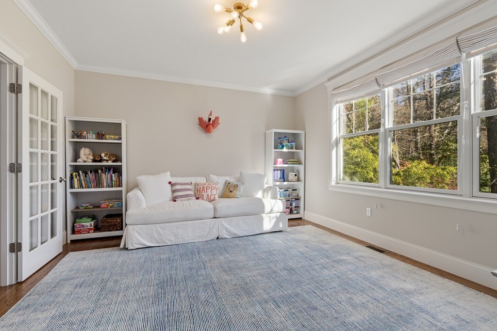 33 Centre Street Dover, MA 02030 - Photo 11 of 32 a living room with furniture and a large window